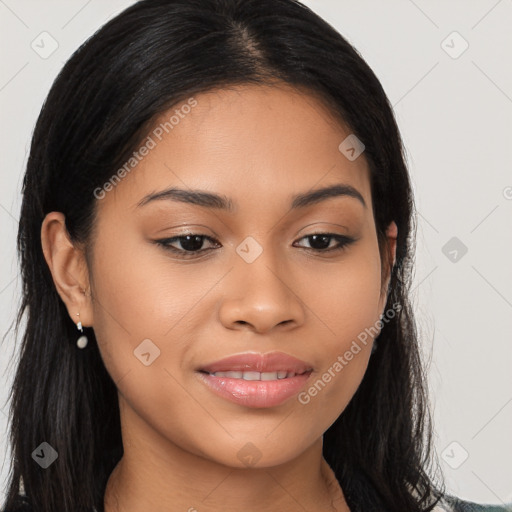 Joyful latino young-adult female with long  brown hair and brown eyes