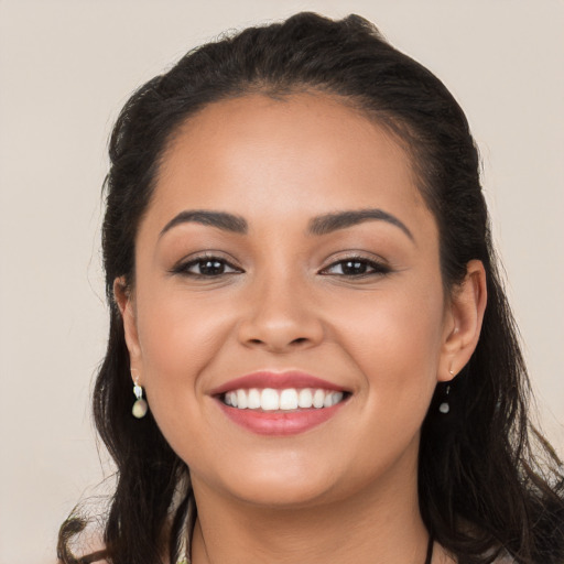 Joyful white young-adult female with long  brown hair and brown eyes