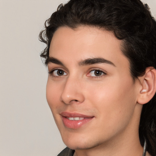 Joyful white young-adult male with medium  black hair and brown eyes