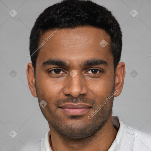 Joyful black young-adult male with short  black hair and brown eyes