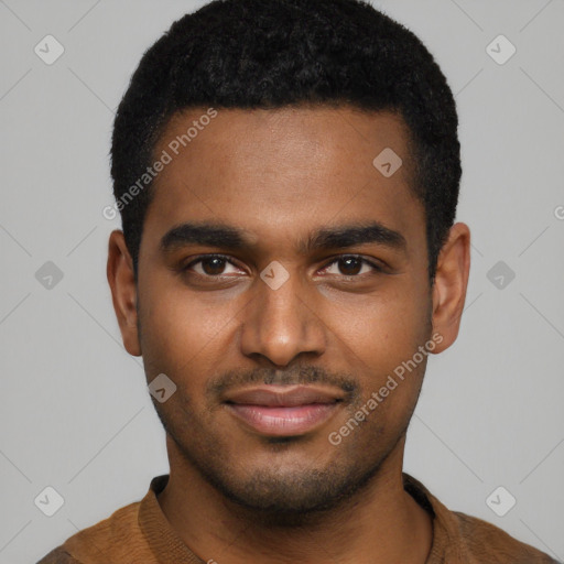 Joyful black young-adult male with short  brown hair and brown eyes