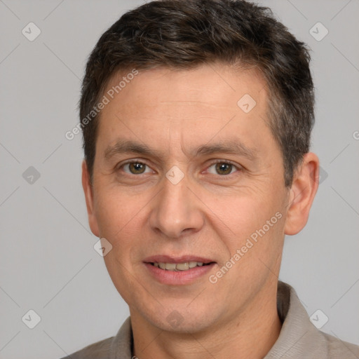 Joyful white adult male with short  brown hair and brown eyes