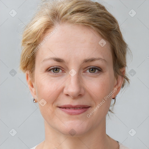 Joyful white adult female with medium  brown hair and grey eyes