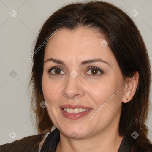 Joyful white adult female with medium  brown hair and brown eyes