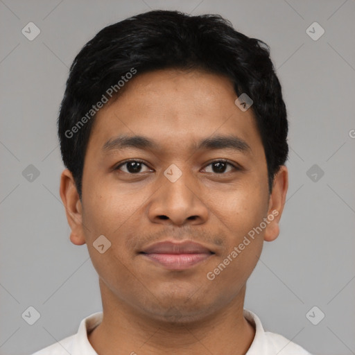 Joyful latino young-adult male with short  black hair and brown eyes