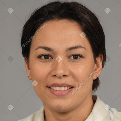 Joyful asian adult female with short  brown hair and brown eyes