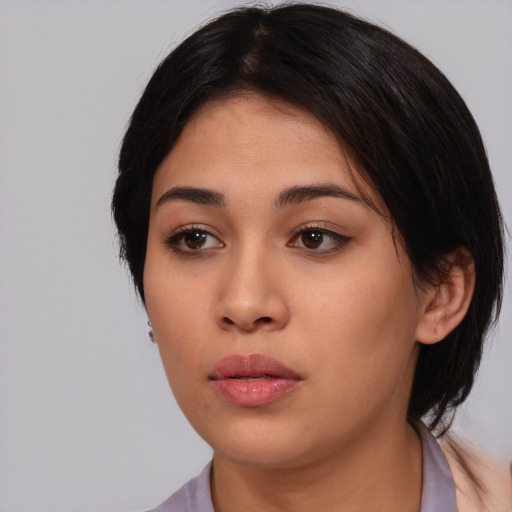 Neutral white young-adult female with medium  black hair and brown eyes