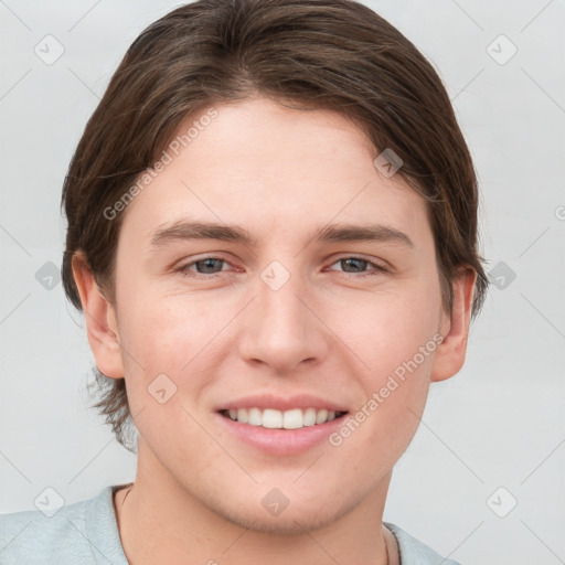 Joyful white young-adult female with short  brown hair and grey eyes