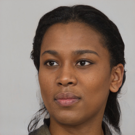 Neutral black young-adult female with medium  black hair and brown eyes