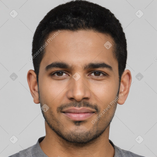 Joyful latino young-adult male with short  black hair and brown eyes