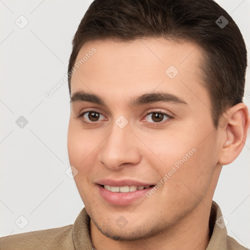 Joyful white young-adult male with short  brown hair and brown eyes