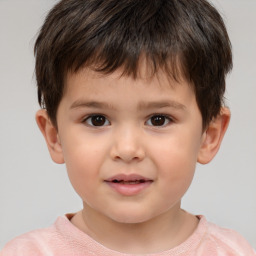 Joyful white child male with short  brown hair and brown eyes