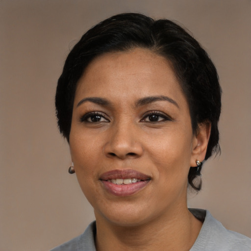 Joyful asian adult female with medium  black hair and brown eyes