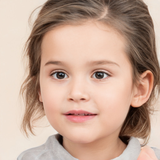 Joyful white child female with medium  brown hair and brown eyes