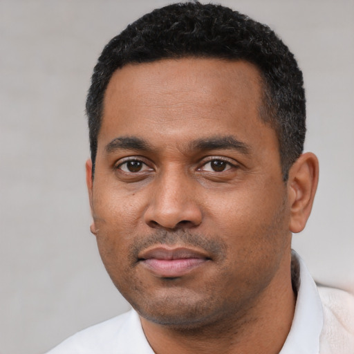 Neutral black young-adult male with short  black hair and brown eyes