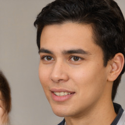 Joyful white young-adult male with medium  brown hair and brown eyes