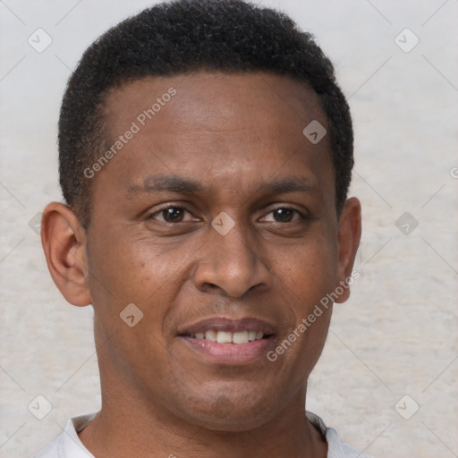 Joyful black young-adult male with short  brown hair and brown eyes