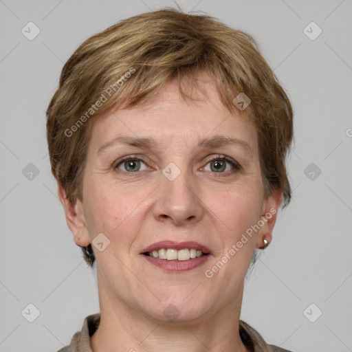 Joyful white adult female with short  brown hair and grey eyes