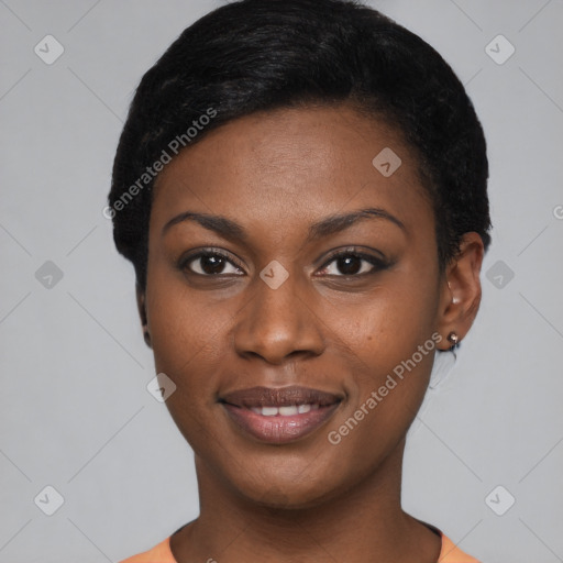 Joyful black young-adult female with short  black hair and brown eyes