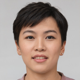 Joyful asian young-adult female with short  brown hair and brown eyes