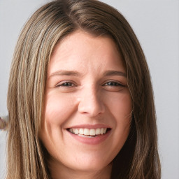 Joyful white young-adult female with long  brown hair and green eyes