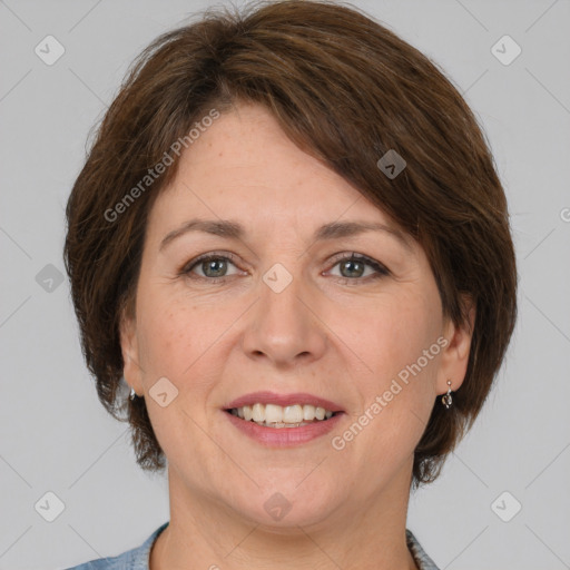 Joyful white adult female with medium  brown hair and grey eyes