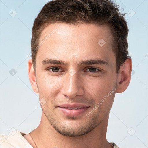 Joyful white young-adult male with short  brown hair and brown eyes