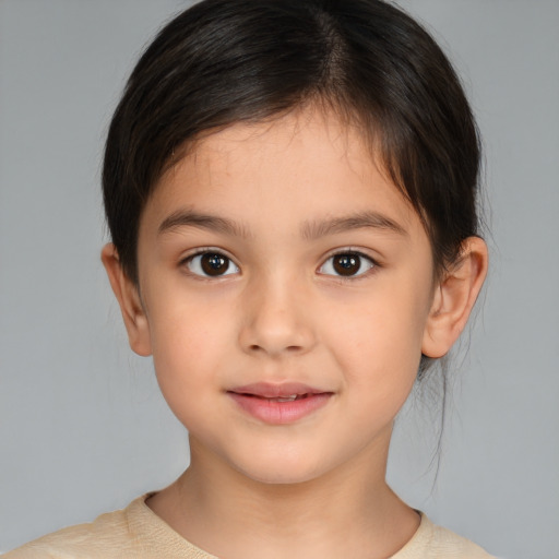 Joyful white child female with medium  brown hair and brown eyes