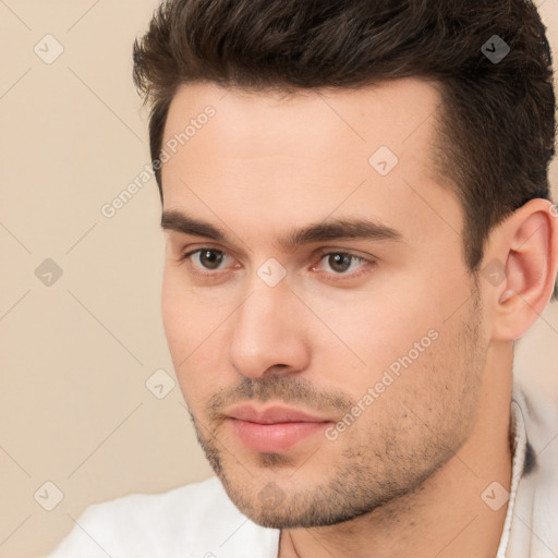 Neutral white young-adult male with short  brown hair and brown eyes