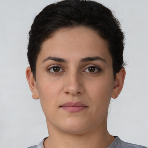 Neutral white young-adult female with short  brown hair and brown eyes