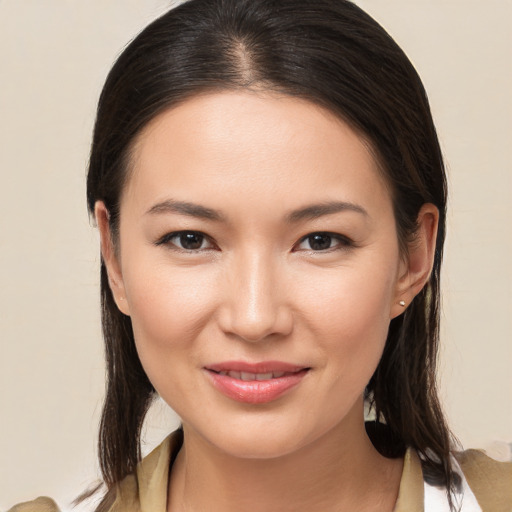 Joyful white young-adult female with medium  brown hair and brown eyes