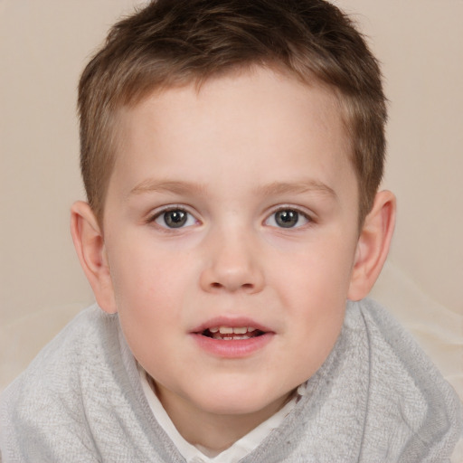 Joyful white child male with short  brown hair and brown eyes