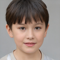 Joyful white child female with short  brown hair and brown eyes