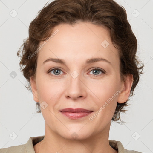 Joyful white young-adult female with medium  brown hair and green eyes