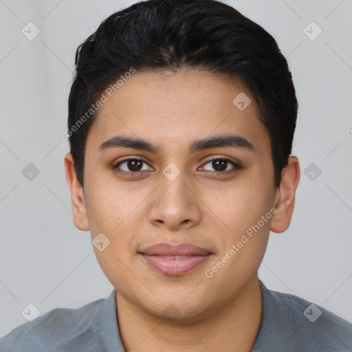 Joyful latino young-adult male with short  black hair and brown eyes