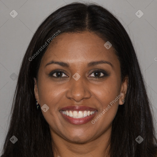 Joyful black young-adult female with long  brown hair and brown eyes