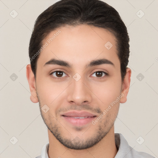 Joyful white young-adult male with short  black hair and brown eyes