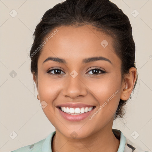 Joyful latino young-adult female with medium  brown hair and brown eyes