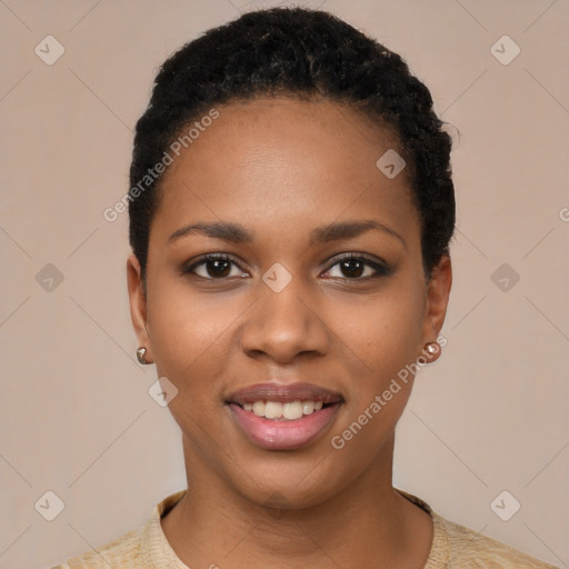 Joyful black young-adult female with short  black hair and brown eyes