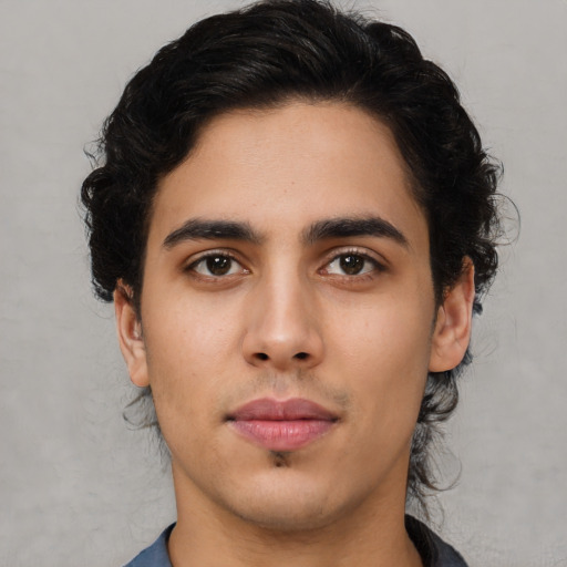 Neutral latino young-adult male with medium  black hair and brown eyes