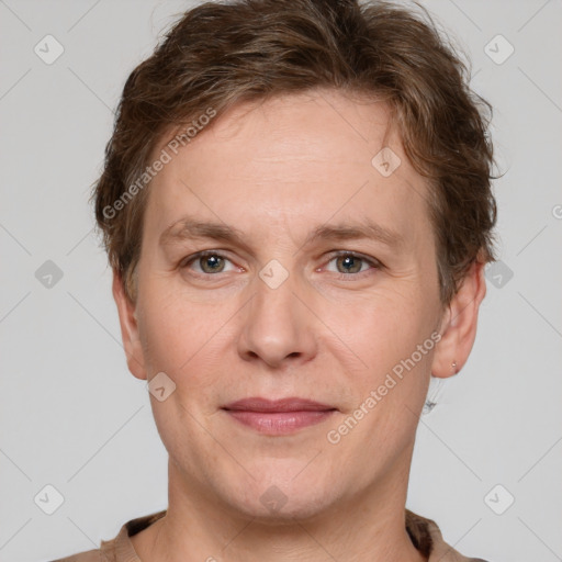 Joyful white adult male with short  brown hair and grey eyes