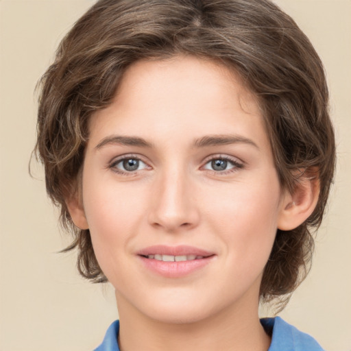 Joyful white young-adult female with medium  brown hair and green eyes