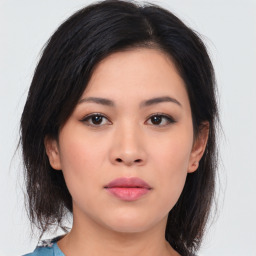 Neutral asian young-adult female with medium  brown hair and brown eyes