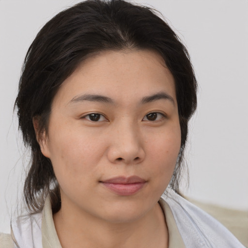 Neutral asian young-adult female with medium  brown hair and brown eyes