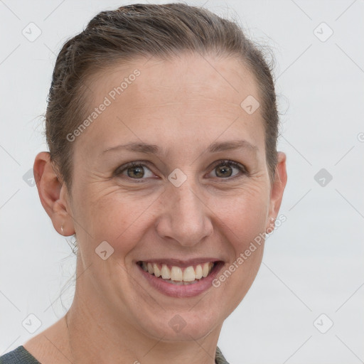 Joyful white adult female with short  brown hair and grey eyes