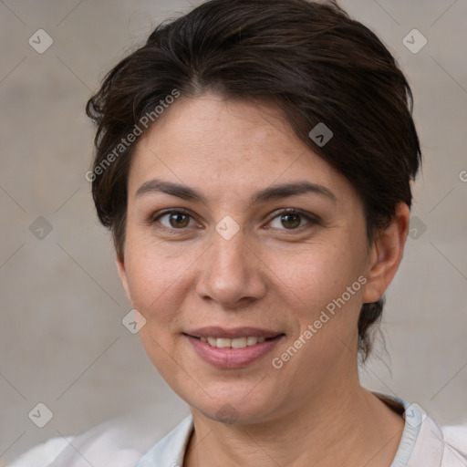 Joyful white adult female with short  brown hair and brown eyes