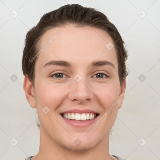 Joyful white young-adult female with short  brown hair and grey eyes