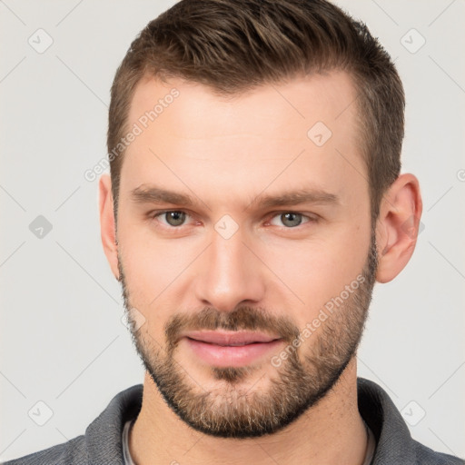 Neutral white young-adult male with short  brown hair and brown eyes