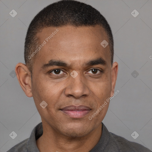 Joyful latino adult male with short  black hair and brown eyes