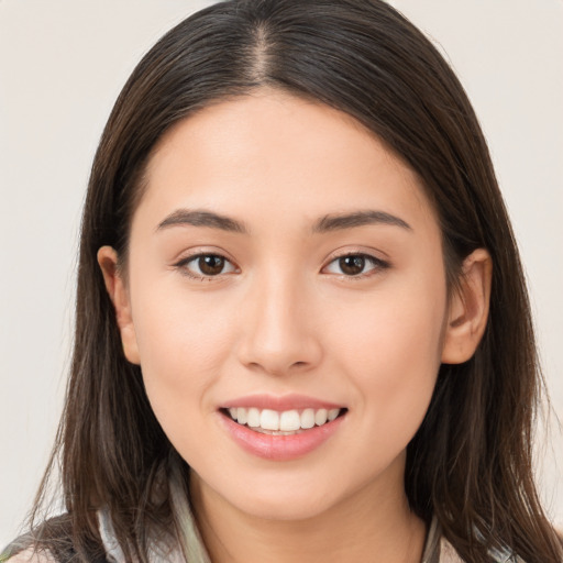 Joyful white young-adult female with long  brown hair and brown eyes